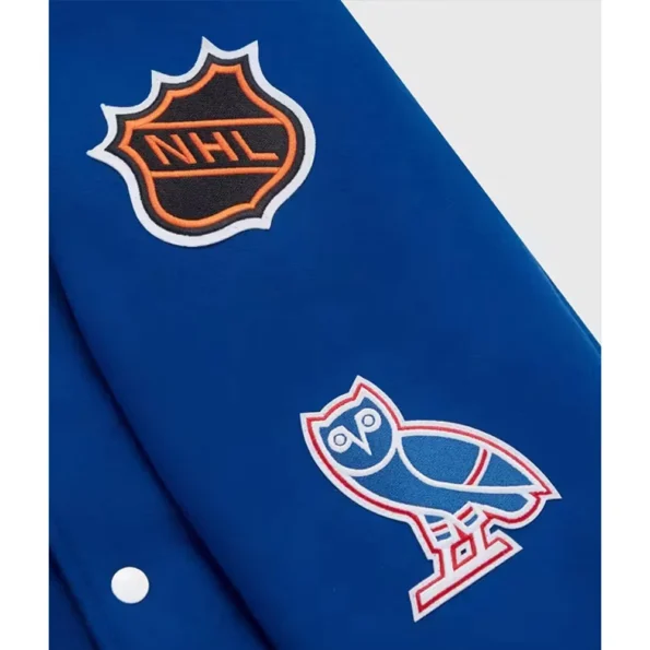 Close-up of OVO New York Rangers Varsity Jacket logo and details