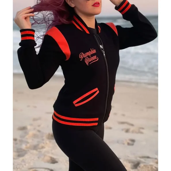 Side view of model in Pumpkin Queen Black Varsity Jacket