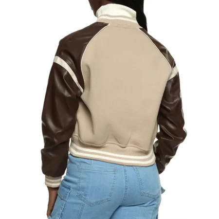 Back view of Ryann McCracken in Ultimatum Varsity Jacket