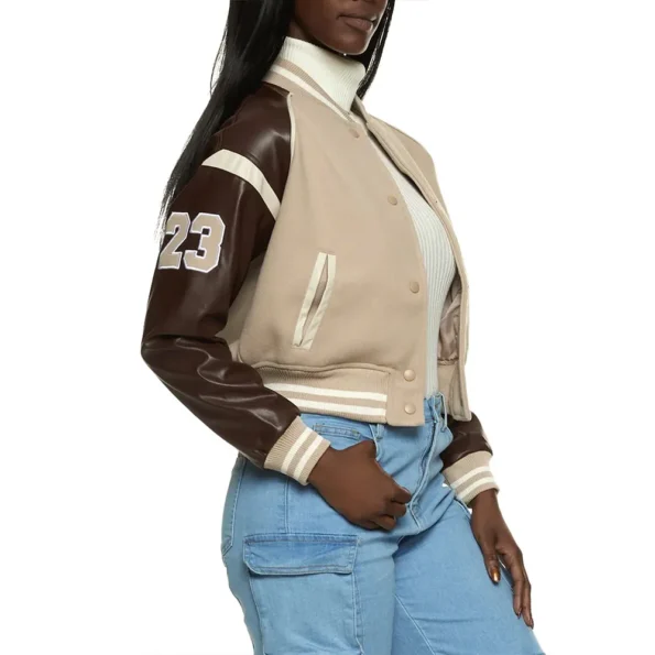 Side view of Ryann McCracken in Ultimatum Varsity Jacket