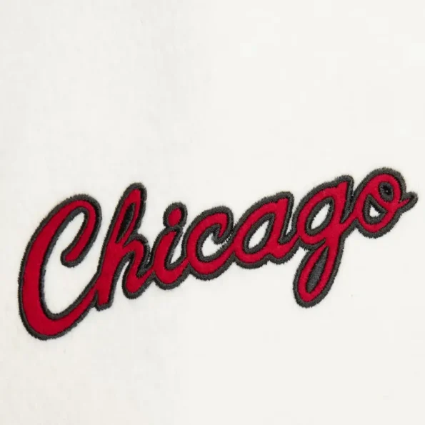 Zoomed view of Chicago Bulls vintage logo varsity jacket details.