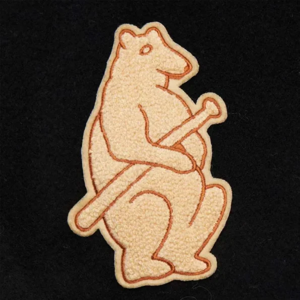 Zoomed view of Chicago Cubs black vintage varsity jacket details.