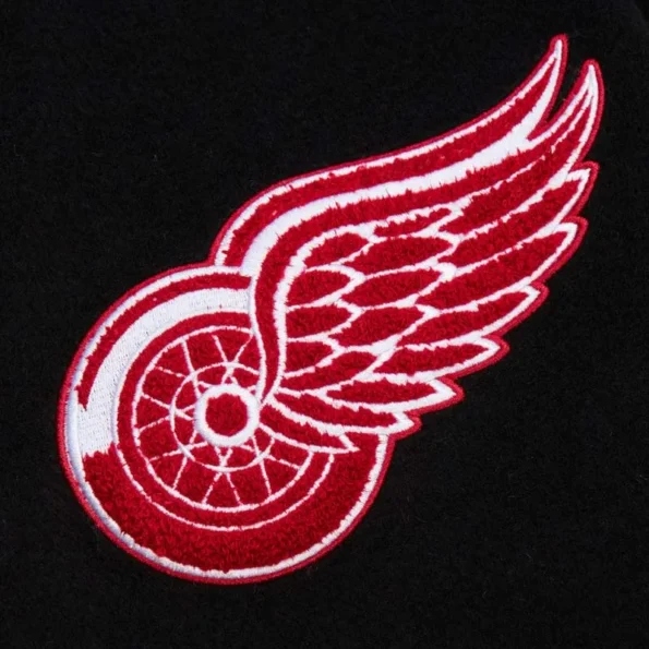 Zoomed view of Detroit Red Wings black varsity jacket details.