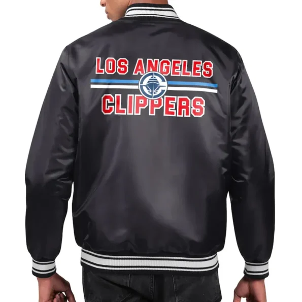 Model wearing LA Clippers printed team varsity jacket back view.