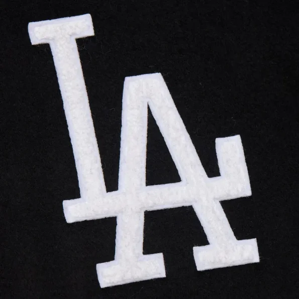 Zoomed view of LA Dodgers black vintage varsity jacket details.