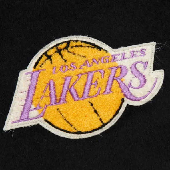 Zoomed view of LA Lakers vintage logo varsity jacket details.