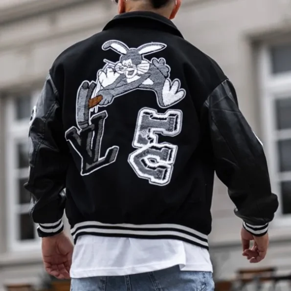 Back view of model in LV Bunny Black Varsity Jacket