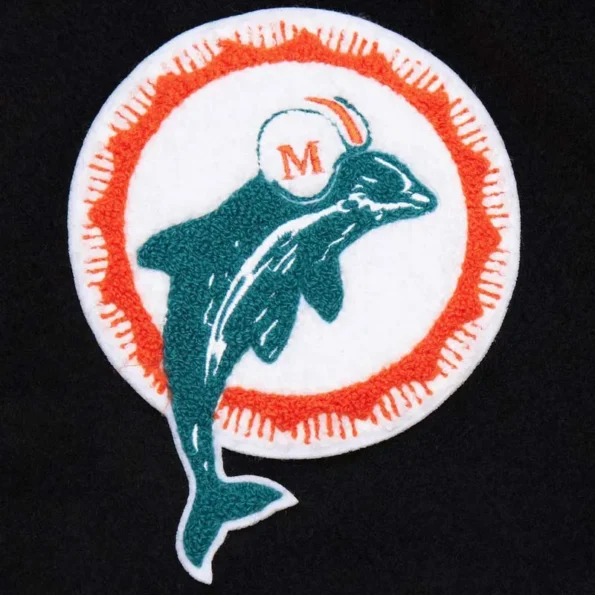 Zoomed view of Miami Dolphins black vintage varsity jacket details.