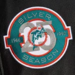 Front view Miami Dolphins black vintage varsity jacket photo.