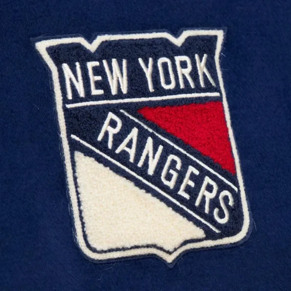 Zoomed view of NY Rangers vintage logo varsity jacket details.