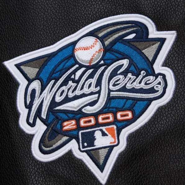 Zoomed view of NY Yankees black vintage varsity jacket details.