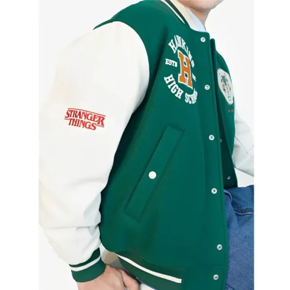 Side view of model in Stranger Things Hawkins Varsity Jacket