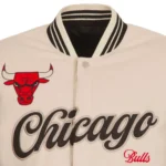 Front view Chicago Bulls cream varsity jacket photo.