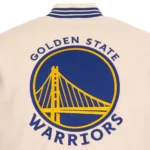 Front view Golden State Warriors cream varsity jacket photo.