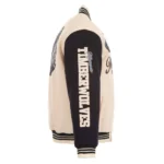 Front view Minnesota Timberwolves cream varsity jacket photo.