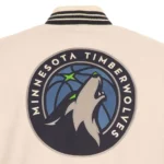 Front view Minnesota Timberwolves cream varsity jacket photo.