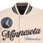 Front view Minnesota Timberwolves cream varsity jacket photo.