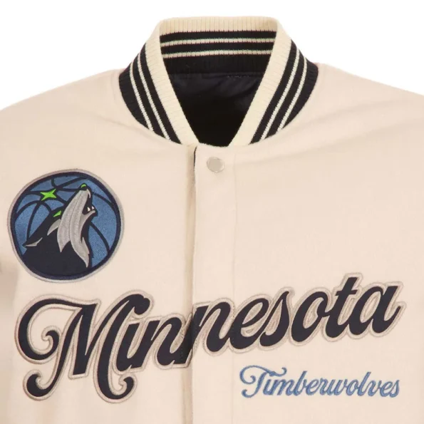 Close-up of Minnesota Timberwolves cream varsity jacket embroidery.