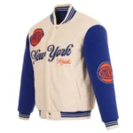 Front view NY Knicks cream and royal varsity jacket photo.