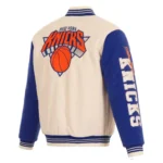 Front view NY Knicks cream and royal varsity jacket photo.