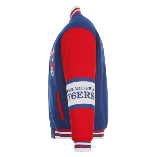 Side view of Philadelphia 76ers royal varsity jacket.