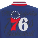 Front view Philadelphia 76ers royal varsity jacket photo.