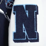 Front view Tennessee Titans mashup rib varsity jacket photo.